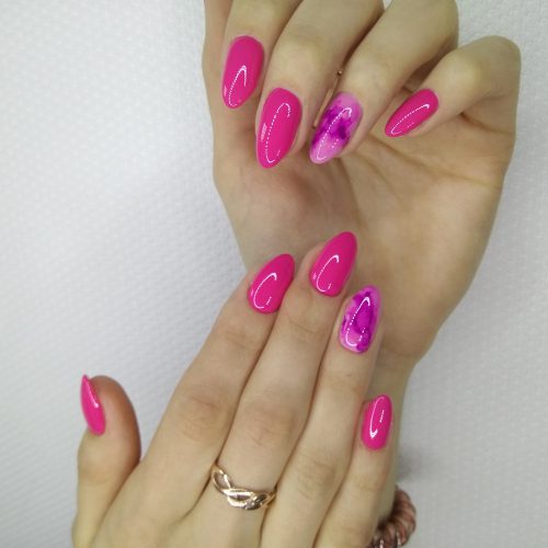 beautiful pink nails on a trendy texture background